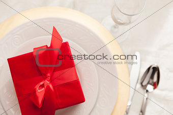 Christmas Gift with Place Setting at Table