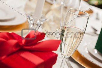 Christmas Gift with Place Setting at Table