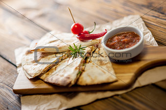 Tacos on wooden background with sauce