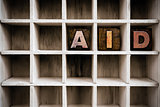 Aid Concept Wooden Letterpress Type in Draw