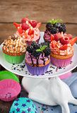 Set of different delicious cupcakes