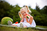 portrait of a little girl eating watermelon