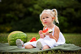 portrait of a little girl eating watermelon