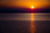 The Rising Sun Over the Sea