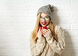 Smiling Hipster Girl in Winter Clothes with Mug
