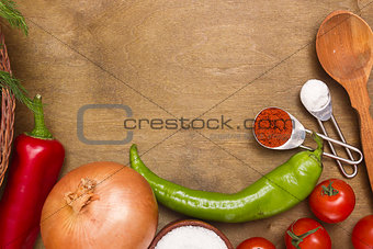 Kitchen surfaces with vegetables and spices