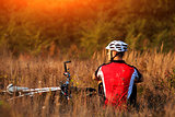 Mountain Bike cyclist resting outdoor with his bike