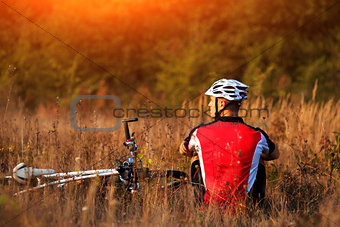 Mountain Bike cyclist resting outdoor with his bike