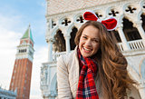 Woman tourist spending Christmas on Piazza San Marco in Venice