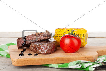 Steak with grilled corn and tomato