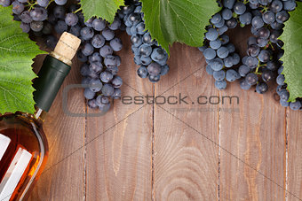 Red grape and wine bottle