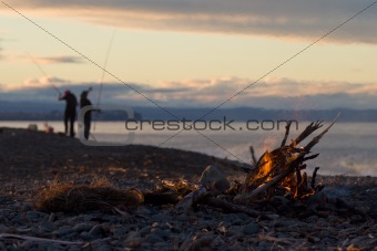 Fire and fishing on the beach