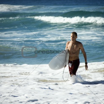 Teen surfer in water.