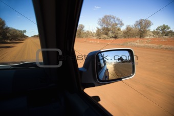 Vehicle on dirt road