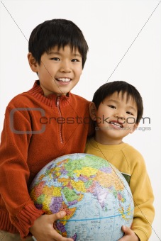 Boys holding globe