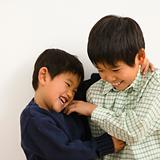 Asian brothers playing