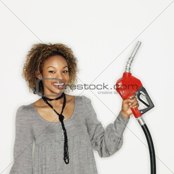 Woman holding gas nozzle