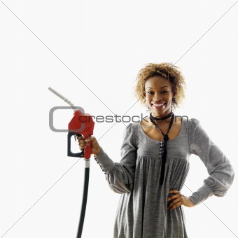 Smiling woman with petro hose