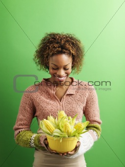 Woman holding corn