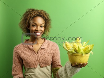 Happy woman with corn