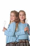 shot of twin girls baking vertical  