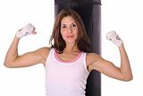 shot of a Fitness girl flexing in front of punching bag