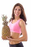 shot of a fitness woman holding a pineapple upclose