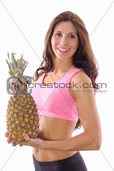 shot of a fitness woman holding a pineapple upclose