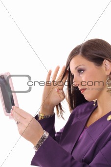 shot of a woman checking makeup vertical