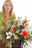shot of a happy florist making flower arrangement