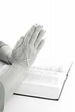 shot of praying hands over bible black & white