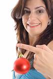 shot of a woman holding Christmas ornament upclose