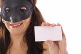 shot of a masked woman holding blank card