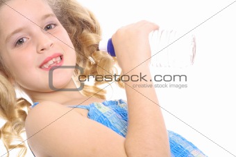 shot of a little girl drinking a bottled water angle
