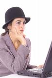 shot of a woman in hat sending email