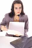 shot of a woman in business suit looking at file