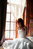Bride in hotel bedroom