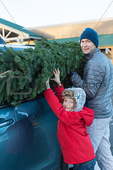 family buying christmas tree