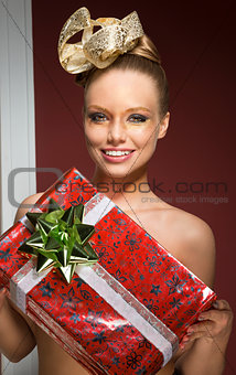 happy creative woman with christmas gift 