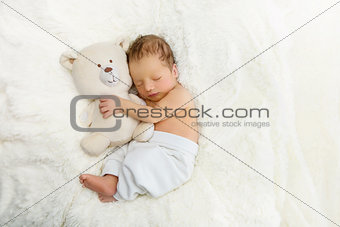 Newborn with toy bear
