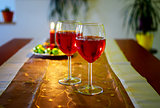 Wine glasses with red wine and christmas decoration