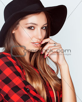 young pretty brunette girl hipster in hat on white background casual close up dreaming smiling