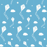 Seamless vector background with white kites in the blue sky