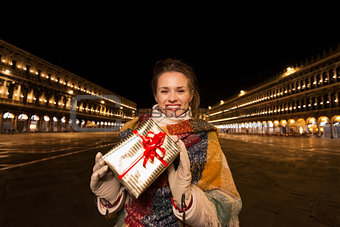 Woman with Christmas gift box on Piazza San Marco, Venice