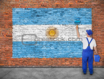 House painter paints flag of Argentina 