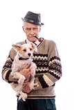 Cute grandpa with a dog sitting on his hands.