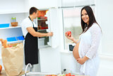pregnant woman with a cup in her hands