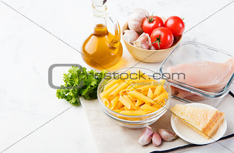 Italian food ingredients: pasta, tomatoes, chicken