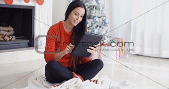 Smiling woman catching up on her social media