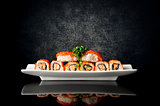 Sushi and rolls in plate